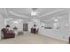 Expansive living area with a large mirror, neutral carpeting, and stylish furniture arrangement at 1152 Ward Creek Sw Dr, Marietta, GA 30064