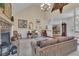 Cozy living room featuring a stone fireplace and high ceilings, offering a comfortable space at 1152 Ward Creek Sw Dr, Marietta, GA 30064