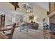 Cozy living room featuring a stone fireplace and high ceilings, offering a comfortable space at 1152 Ward Creek Sw Dr, Marietta, GA 30064
