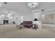 Spacious living room with a fireplace, comfortable sofa and a unique stain-glass ceiling fixture at 1152 Ward Creek Sw Dr, Marietta, GA 30064