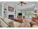 Spacious living room featuring a fireplace, built-in shelving, and access to the outdoor patio at 1152 Ward Creek Sw Dr, Marietta, GA 30064