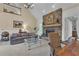 Bright living room with vaulted ceilings and a stone fireplace, creating a warm and inviting ambiance at 1152 Ward Creek Sw Dr, Marietta, GA 30064