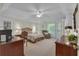 Spacious main bedroom featuring a seating area, tray ceiling, and neutral-colored walls at 1152 Ward Creek Sw Dr, Marietta, GA 30064