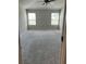 Spacious primary bedroom with soft carpeting and abundant natural light at 11600 Winston Dr, Hampton, GA 30228