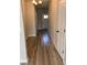 Inviting hallway with light walls and hardwood floors at 11600 Winston Dr, Hampton, GA 30228