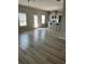 Open-concept living room featuring lots of natural light and modern flooring at 11600 Winston Dr, Hampton, GA 30228