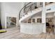 Open basement with a spiral staircase, stone bar, and a view of the wine cellar at 4 Vale Close Ne Ct, Atlanta, GA 30324