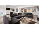 Finished basement area features a large sectional sofa, ping pong table, and framed sports jerseys at 4 Vale Close Ne Ct, Atlanta, GA 30324