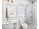 Modern bathroom with glass shower, white tiles, and sleek fixtures at 4 Vale Close Ne Ct, Atlanta, GA 30324