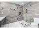 Beautiful bathroom features a glass shower, gray tile, and marble floors at 4 Vale Close Ne Ct, Atlanta, GA 30324