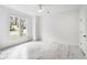 Bright bedroom with large window, marble floors, and modern ceiling fan at 4 Vale Close Ne Ct, Atlanta, GA 30324