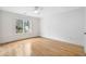 Bright bedroom with hardwood floors, a ceiling fan, and natural light at 4 Vale Close Ne Ct, Atlanta, GA 30324