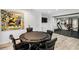 Fun game room area includes a poker table and a view into the exercise room with glass doors at 4 Vale Close Ne Ct, Atlanta, GA 30324