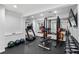This home boasts a complete fitness center including free weights, weight rack, medicine balls, and treadmill at 4 Vale Close Ne Ct, Atlanta, GA 30324