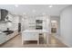 Well-lit kitchen featuring a center island, stainless steel appliances, and hardwood floors at 4 Vale Close Ne Ct, Atlanta, GA 30324