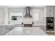 Stylish kitchen equipped with a center island, farmhouse sink, and stainless steel appliances at 4 Vale Close Ne Ct, Atlanta, GA 30324
