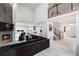 Open-concept living area with fireplace, modern decor, and seamless flow to the kitchen at 4 Vale Close Ne Ct, Atlanta, GA 30324
