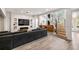 Spacious living room featuring modern recessed lighting, fireplace, spiral staircase and luxury vinyl floors at 4 Vale Close Ne Ct, Atlanta, GA 30324