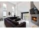 Spacious living room boasting a high ceiling, fireplace, and ample natural light at 4 Vale Close Ne Ct, Atlanta, GA 30324