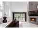 Cozy living room featuring a modern fireplace and great natural light at 4 Vale Close Ne Ct, Atlanta, GA 30324