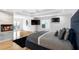 Luxurious main bedroom featuring a fireplace, balcony access, and hardwood flooring at 4 Vale Close Ne Ct, Atlanta, GA 30324