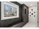 Stunning shower with black tile, a built-in bench, and multiple shower heads for a spa-like experience at 4 Vale Close Ne Ct, Atlanta, GA 30324