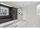Luxurious walk-in shower featuring dark tile accents, glass enclosure, and multiple shower heads at 4 Vale Close Ne Ct, Atlanta, GA 30324