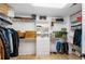 Organized walk-in closet with custom shelving and ample storage space for clothes and accessories at 4 Vale Close Ne Ct, Atlanta, GA 30324