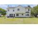 Backyard of home featuring a patio and nice green grass at 48 Savanna Ct, Powder Springs, GA 30127