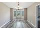 Bright dining room with hardwood floors and bay window, perfect for Gathering meals at 48 Savanna Ct, Powder Springs, GA 30127