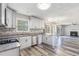 Modern kitchen with stainless steel appliances, granite countertops, and hardwood floors at 48 Savanna Ct, Powder Springs, GA 30127