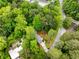 Aerial view of a home with a pool surrounded by lush, green trees and landscaping at 504 Kingswood Nw Ln, Atlanta, GA 30305