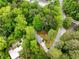 Stunning aerial view of a home nestled among lush greenery with a pool and surrounding landscape at 504 Kingswood Nw Ln, Atlanta, GA 30305