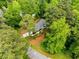 Aerial view of home surrounded by mature trees, showcasing the property's peaceful setting at 504 Kingswood Nw Ln, Atlanta, GA 30305