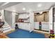 Finished basement space with laundry area, storage cabinets, and bright, recessed lighting at 504 Kingswood Nw Ln, Atlanta, GA 30305