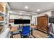 Basement office area with built-in shelving and an adjustable standing desk at 504 Kingswood Nw Ln, Atlanta, GA 30305