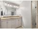 Elegant bathroom boasts a double vanity with granite countertops and a spacious glass-enclosed shower at 504 Kingswood Nw Ln, Atlanta, GA 30305