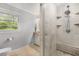 Bathroom featuring a separate tiled walk-in shower and toilet in an enclosed area at 504 Kingswood Nw Ln, Atlanta, GA 30305