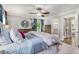 Comfortable bedroom features a bed with patterned bedding, a ceiling fan, and access to an en-suite bathroom at 504 Kingswood Nw Ln, Atlanta, GA 30305