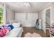 Comfortable bedroom featuring hardwood floors, large closets, and playful decor at 504 Kingswood Nw Ln, Atlanta, GA 30305