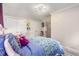 Bedroom view with a double closet, bed with blue patterned comforter and a ceiling fan with flower design at 504 Kingswood Nw Ln, Atlanta, GA 30305