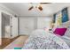 Bedroom featuring hardwood floors and two large closets with an adjacent window at 504 Kingswood Nw Ln, Atlanta, GA 30305