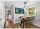 Charming dining area offers a rustic table, decorative lighting, and natural light from the adjacent window at 504 Kingswood Nw Ln, Atlanta, GA 30305