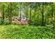 Secluded home nestled in lush greenery, offering privacy and a serene setting at 504 Kingswood Nw Ln, Atlanta, GA 30305