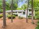 Charming white-painted brick home with a well-manicured lawn and inviting blue door at 504 Kingswood Nw Ln, Atlanta, GA 30305