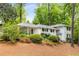 Home with a classic facade, complemented by beautiful landscaping and a welcoming entrance at 504 Kingswood Nw Ln, Atlanta, GA 30305