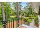 Inviting front porch with brick flooring offers views of lush greenery and the surrounding neighborhood at 504 Kingswood Nw Ln, Atlanta, GA 30305