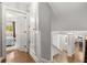 Bright hallway with hardwood floors leads to a bedroom and kitchen, offering a glimpse of interior design at 504 Kingswood Nw Ln, Atlanta, GA 30305