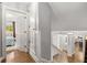 Upper level hallway leading to the bedrooms and kitchen at 504 Kingswood Nw Ln, Atlanta, GA 30305
