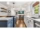 Bright kitchen showcasing white cabinets, stainless appliances, and granite countertops at 504 Kingswood Nw Ln, Atlanta, GA 30305